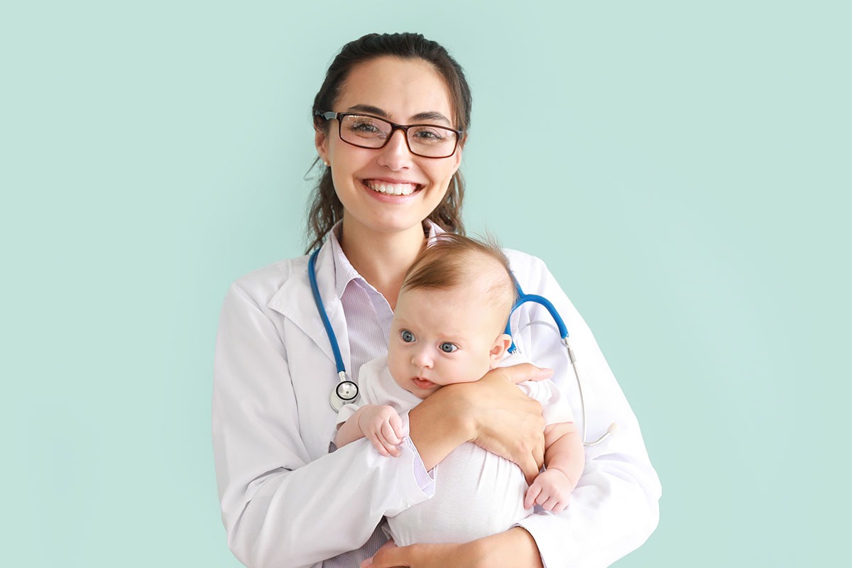 Pediatrician holding a baby