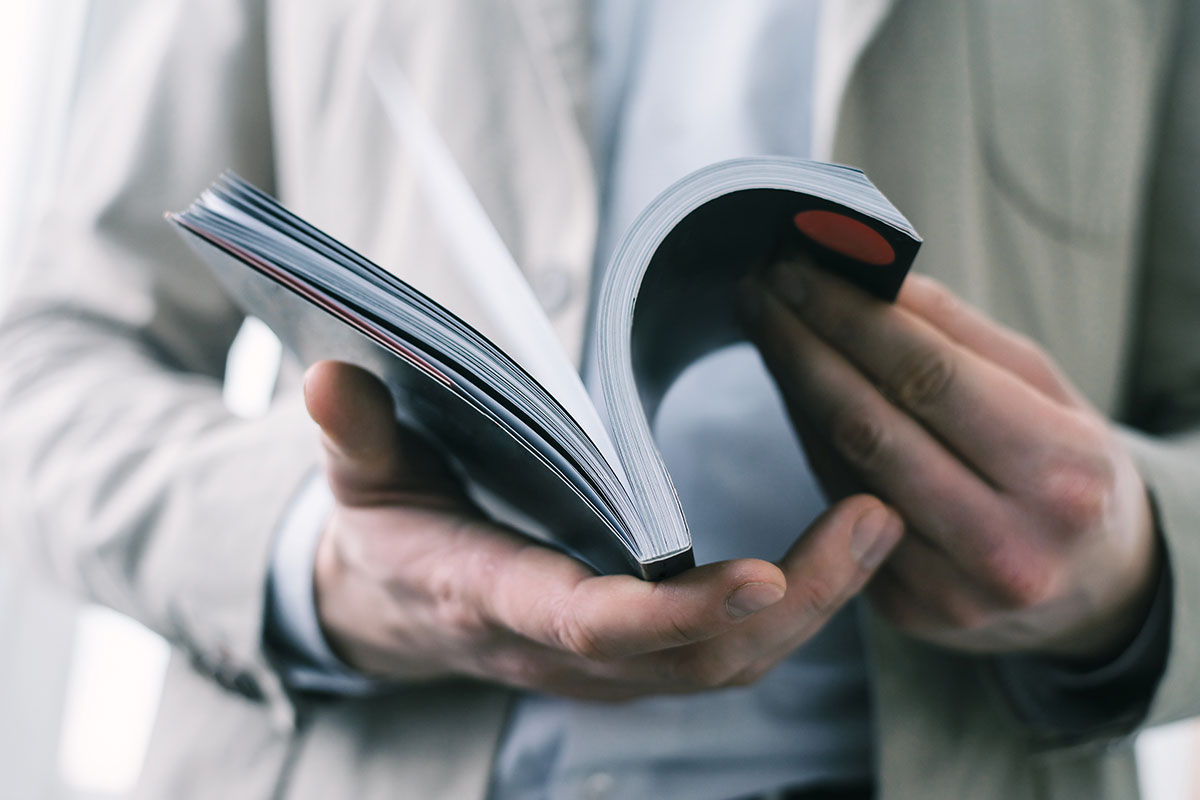 A man flipping through a book